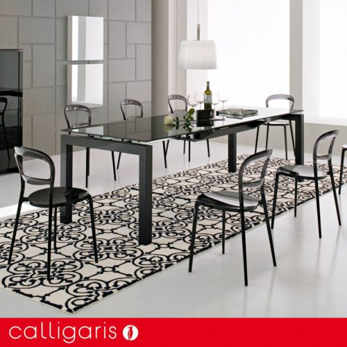 Glass dining tables by Calligaris. Airport etched